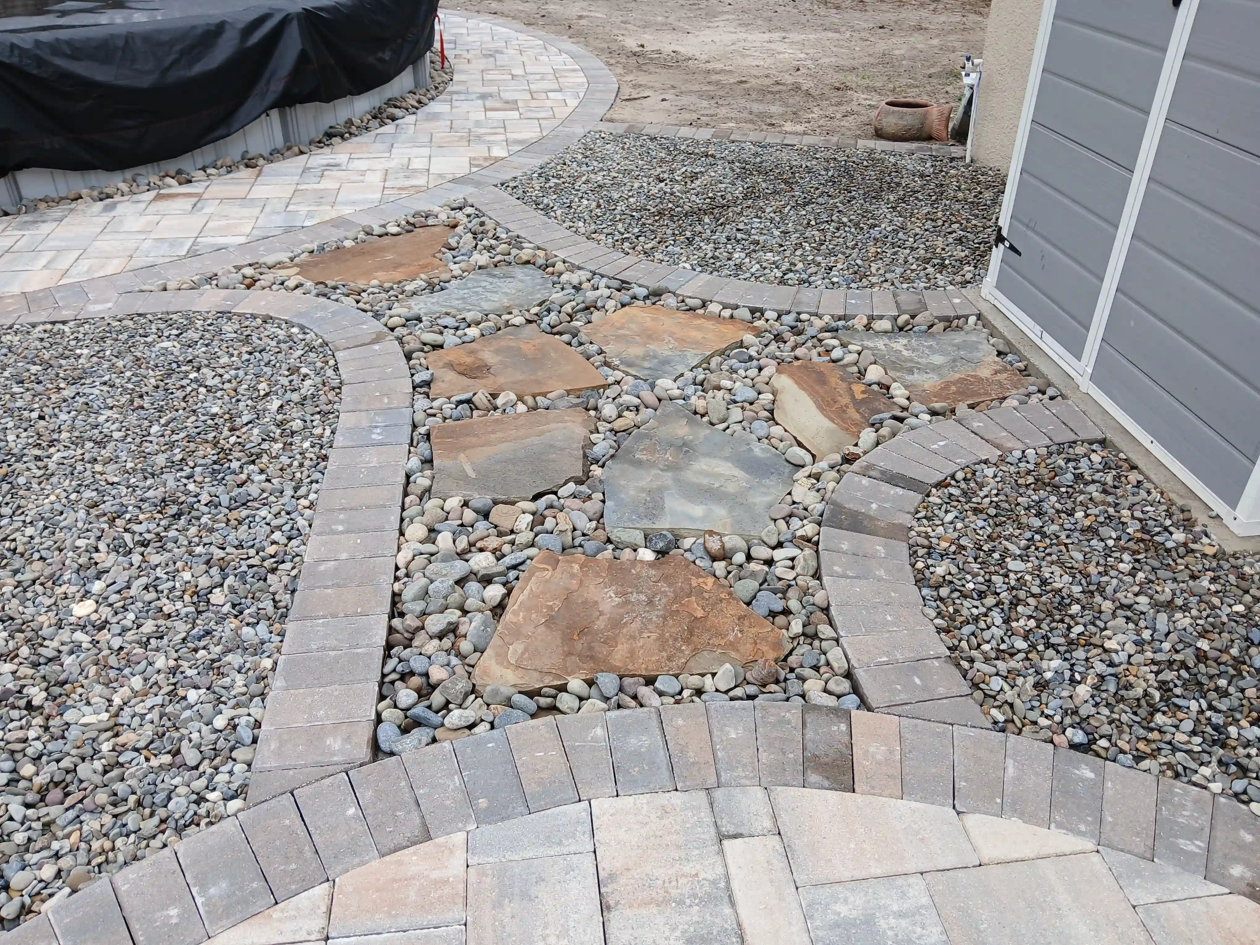 Flagstone walkway with decorative stone